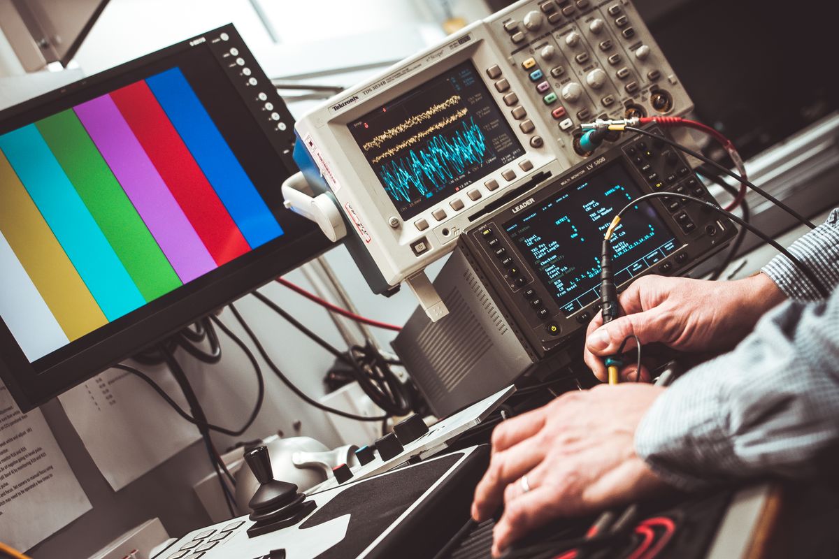 Logic analyzer connected to a circuit board during signal-level testing