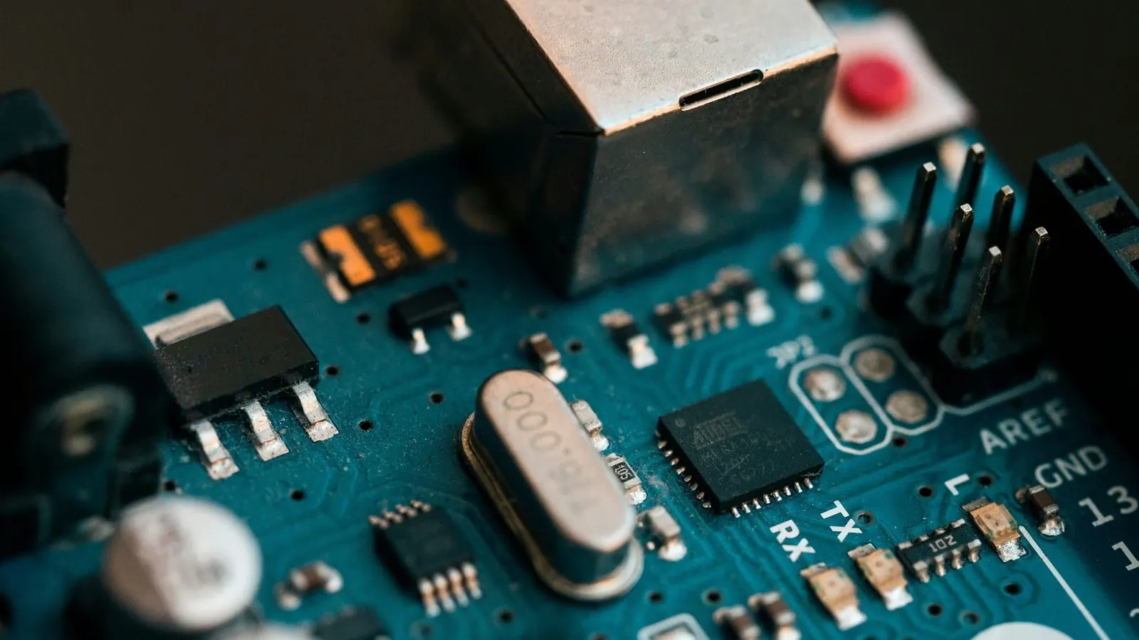 Macro detail of a populated printed circuit board showing individual components